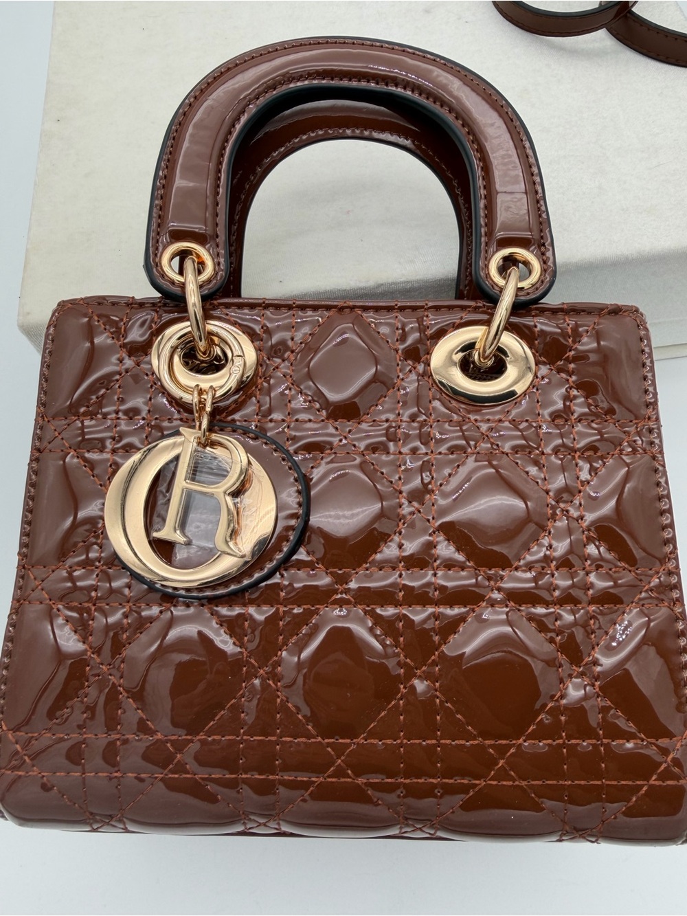 Beautiful, Brown Patent leather mini Bag with Gold Charm - Picture 8 of 15